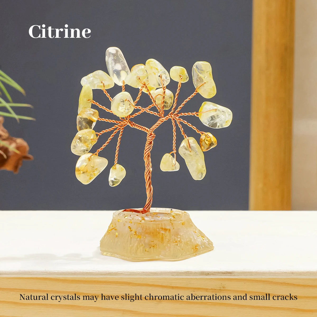 A Citrine crystal tree featuring natural yellow-toned stones mounted on a base.