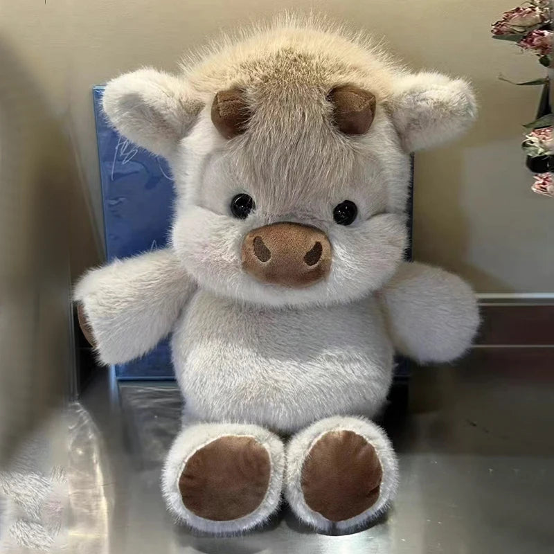 A fluffy, light gray West Highland Calf plush toy with brown accents.