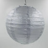 A round, silver foil paper lantern hanging, used for parties or weddings.
