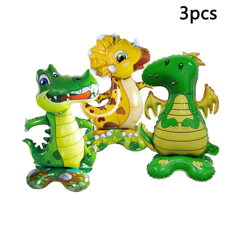 Three foil animal balloons featuring a lion, a giraffe, and a green dinosaur.