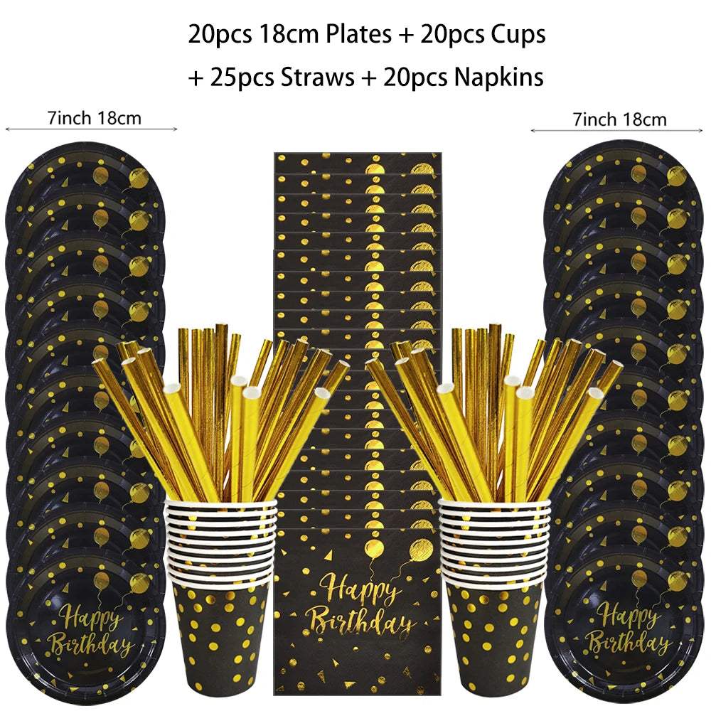 A set of black and gold disposable dinnerware including plates, cups, straws, and napkins.