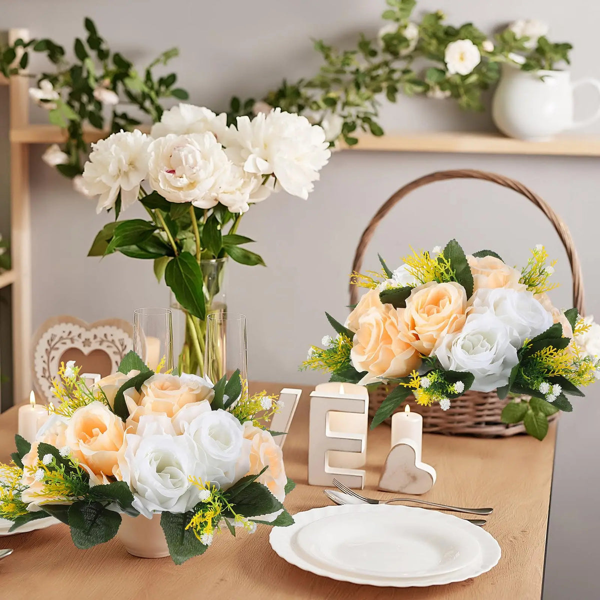 A floral arrangement featuring white and peach roses in a rustic setting with greenery and natural wood elements.