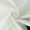 A close-up of a white polyester tapestry fabric folded into a swirl.