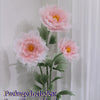Artificial silk pink poppy flower arrangement with three flower heads, stems, and a base.