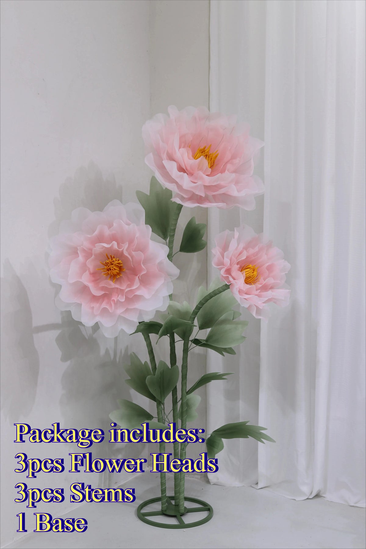 Artificial silk pink poppy flower arrangement with three flower heads, stems, and a base.