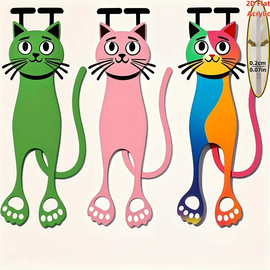 A set of three decorative acrylic cat bookmarks in green, pink, and orange colors.