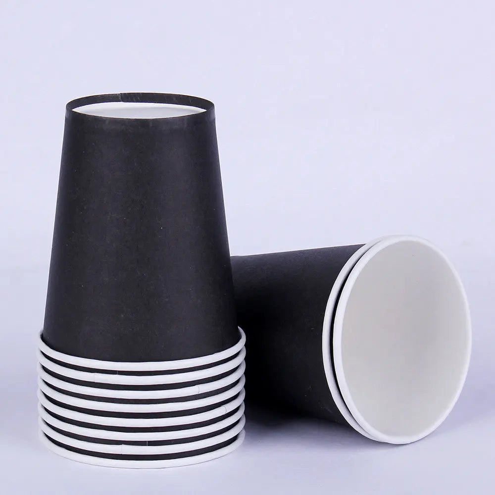 A stack of black and white disposable tableware cups.