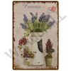 A vintage metal sign featuring a floral arrangement of lavender in a white vase against a rustic background.