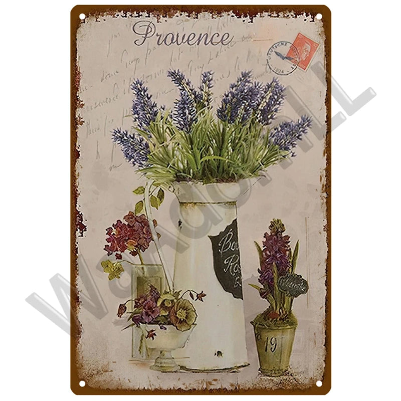 A vintage metal sign featuring a floral arrangement of lavender in a white vase against a rustic background.