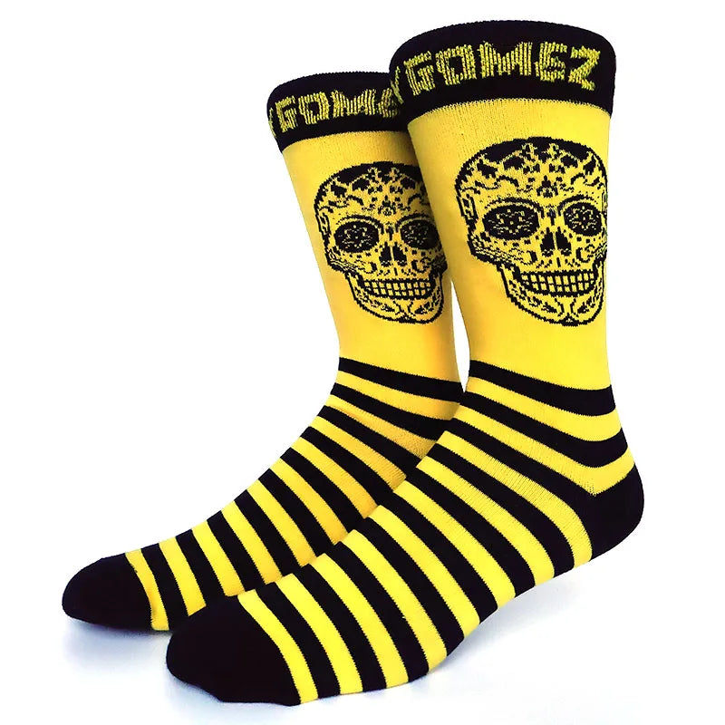 A pair of yellow and black novelty crew socks featuring skull prints.