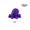 A purple octopuses figurine with tentacles, a cute octopus for desk decoration.