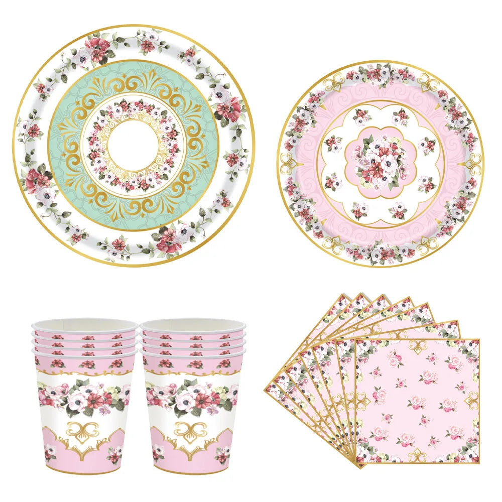 Vintage floral paper party tableware set including plates, cups, and napkins in pink and green tones
