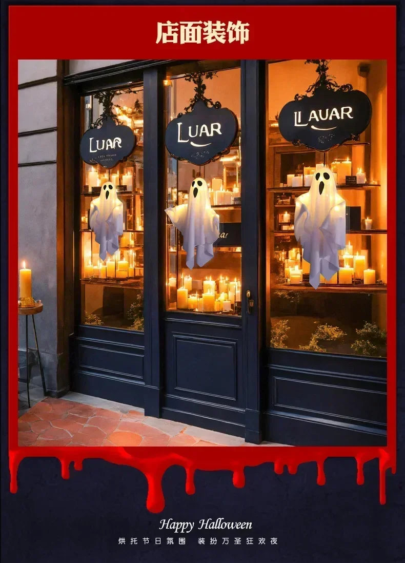 A display of dark-colored glass doors featuring hanging LED ghost decorations for Halloween.