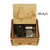 A wooden music box featuring an anime character design on the lid and a mechanical mechanism inside.