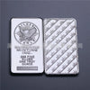 A silver bullion bar replica is shown, featuring an eagle design and the inscription "SILVER MINTING INC. .999 FINE SILVER ON