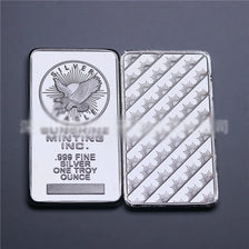 A silver bullion bar replica is shown, featuring an eagle design and the inscription "SILVER MINTING INC. .999 FINE SILVER ON