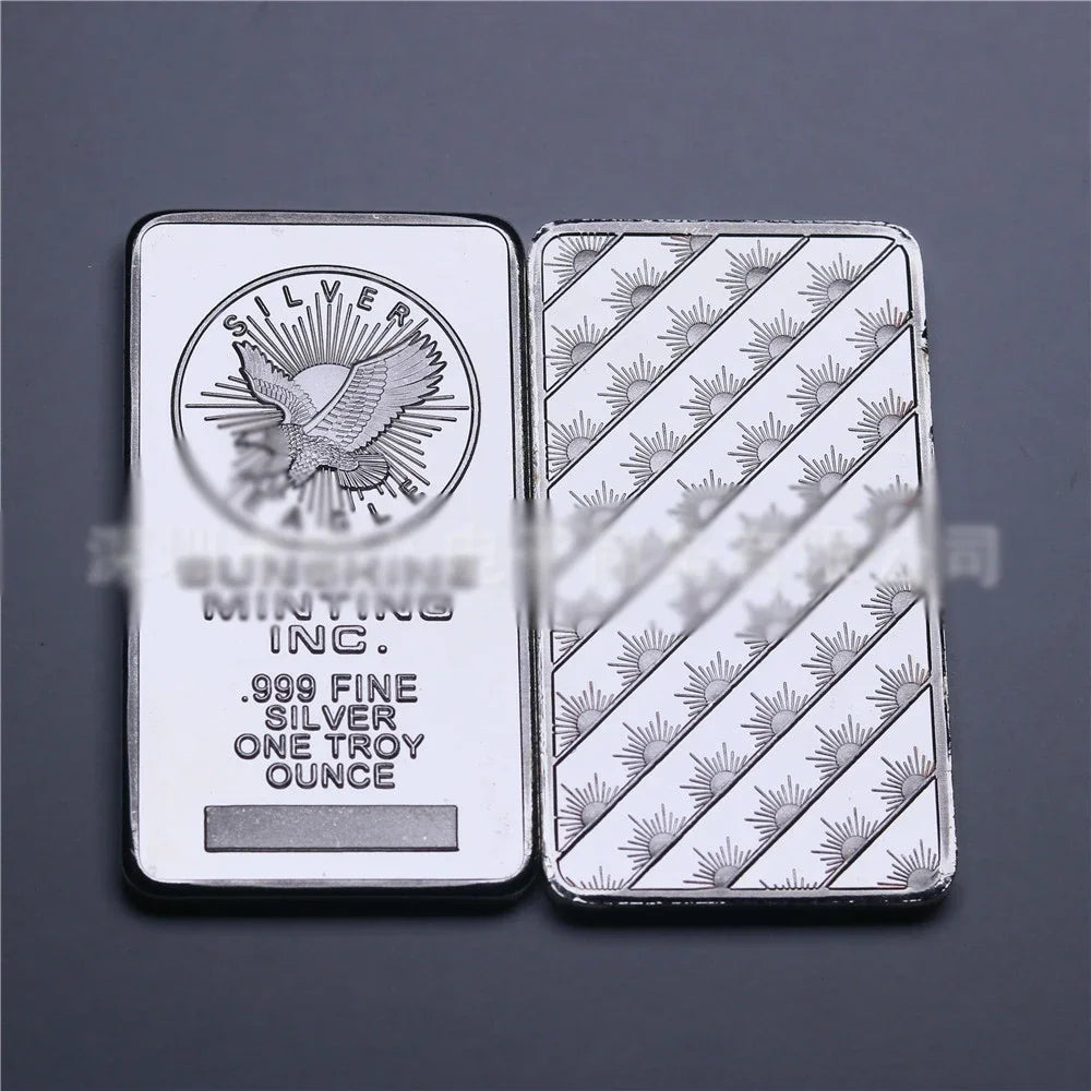 A silver bullion bar replica is shown, featuring an eagle design and the inscription "SILVER MINTING INC. .999 FINE SILVER ON
