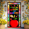 A vibrant vinyl backdrop banner featuring a welcome back to school theme with colorful elements and a large red apple.