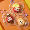 A collection of themed squeeze toys in clear plastic bags featuring cute animal and food characters on an orange tray.