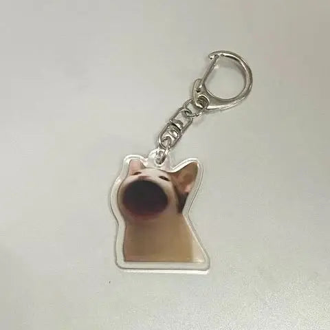 Silver acrylic keychain featuring a cute cat face with a happy expression