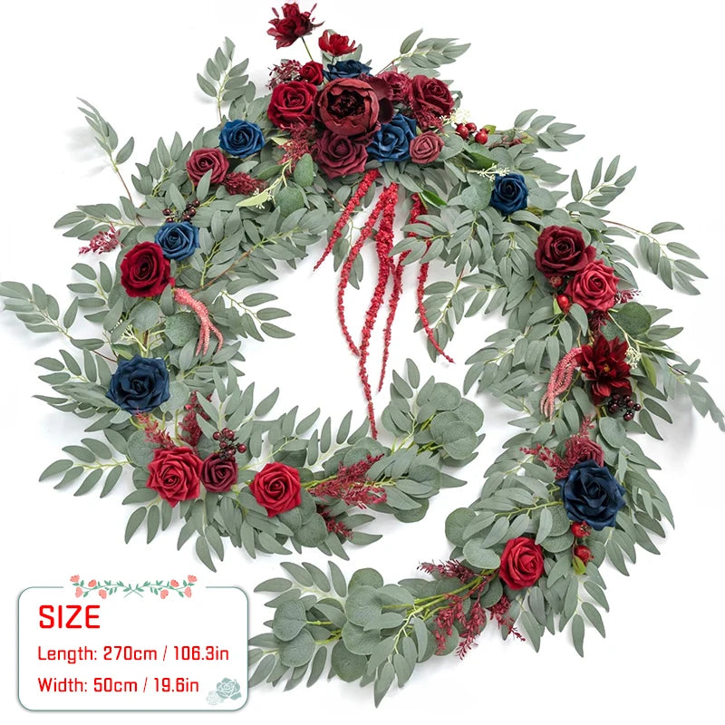 Artificial eucalyptus garland featuring deep red and blue rose flowers for weddings and events