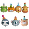 A collection of foil balloons shaped like various jungle animals including a lion, a monkey, and a elephant.