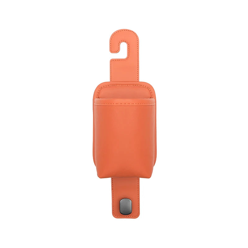 An orange leather car seat back organizer with a headrest hanger and a clip.