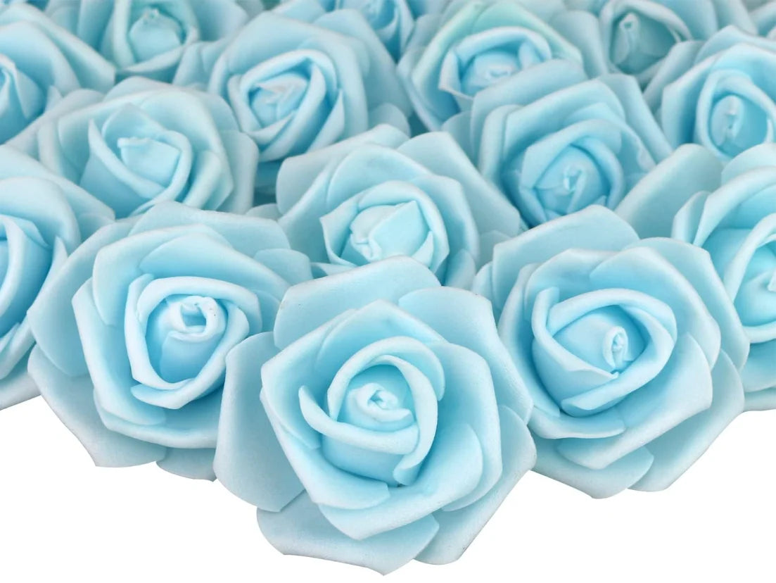 A close-up view of many light blue artificial foam rose decorations.