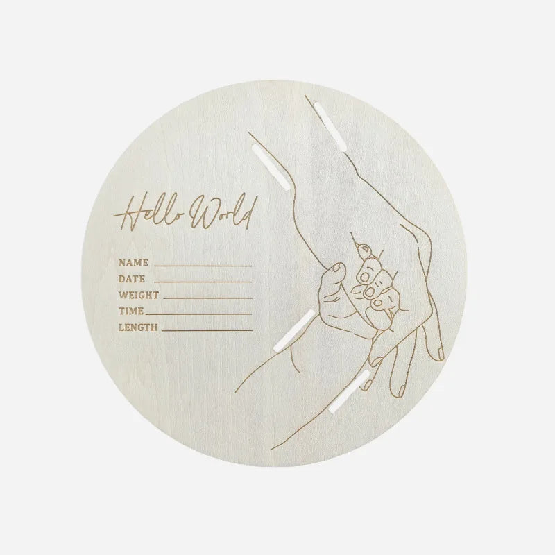 A circular wooden sign featuring a handprint design and lines for personal details like name, date, weight, time, and length.