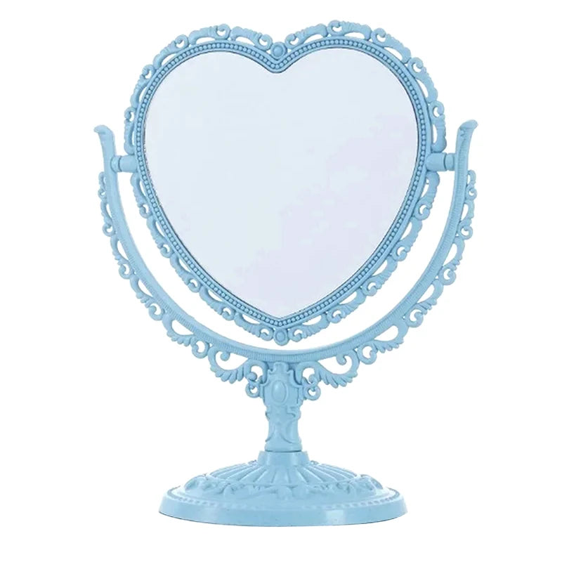 Espejo de maquillaje con forma de corazón y doble cara azul claro con marco plateado ornamentado