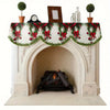 Festive Christmas fireplace scarf featuring a pine and berry print displayed above a white mantelpiece.