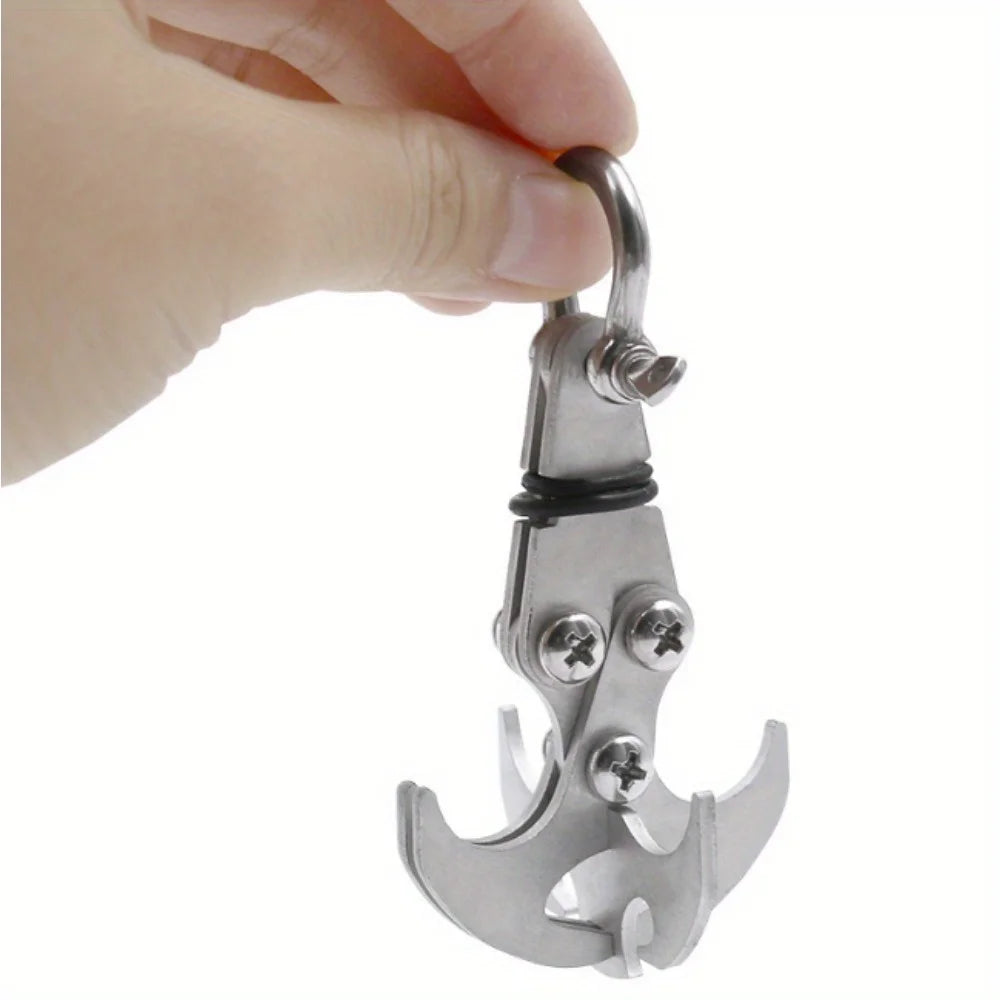 A hand is holding a heavy duty stainless steel gravity hook multi-tool with a curved hook shape.