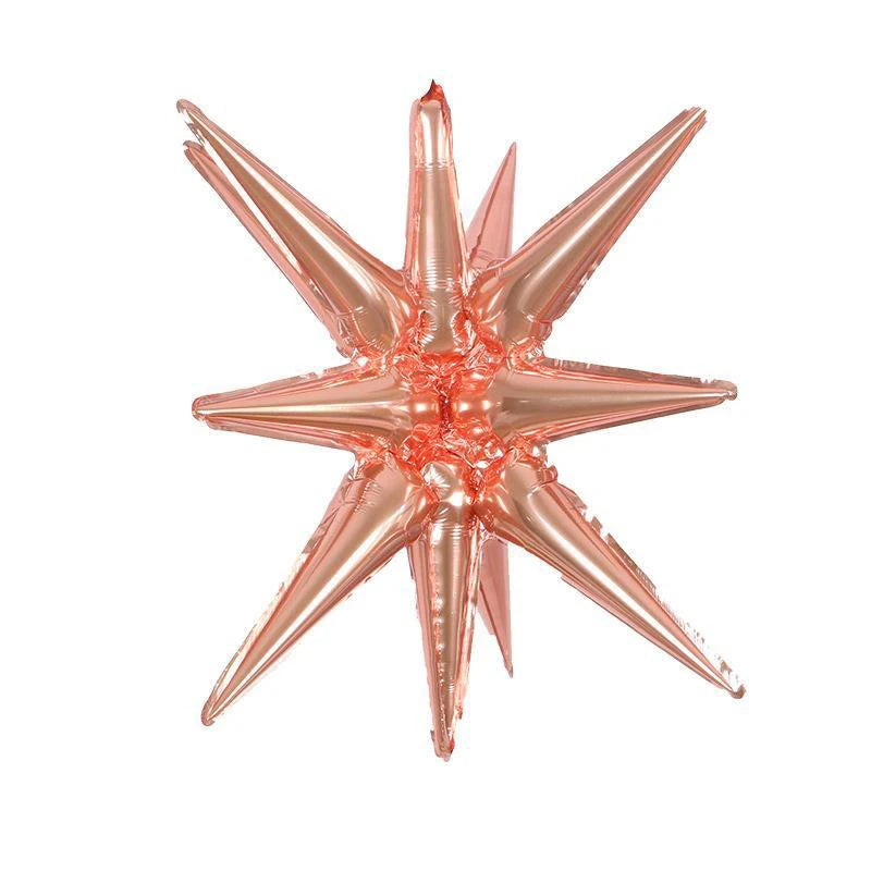 A cluster of rose gold star burst foil balloons for party decor