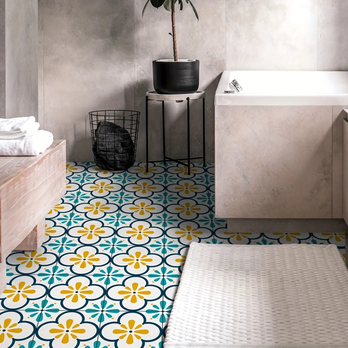 A close-up view of Moroccan pattern floor stickers featuring yellow and blue floral designs on a white background.