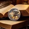 A commemorative coin depicting Jesus Christ with a crown, set against a background of mountains and light, resting on an open