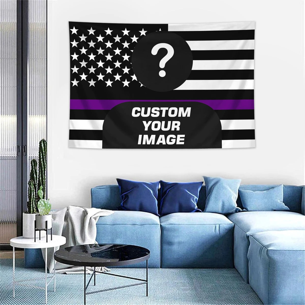 A blue sofa and modern table are set against a white wall with a custom photo American flag tapestry hanging above.