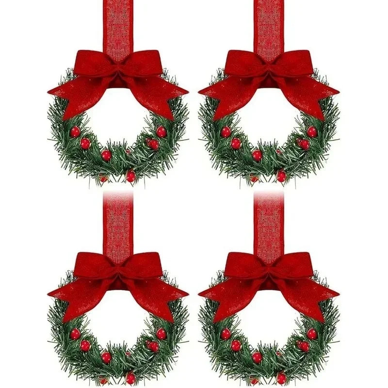 Set of four mini Christmas wreaths with red ribbon bows and red berries
