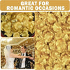 A close-up of golden silk rose petals scattered for romantic occasions and weddings.