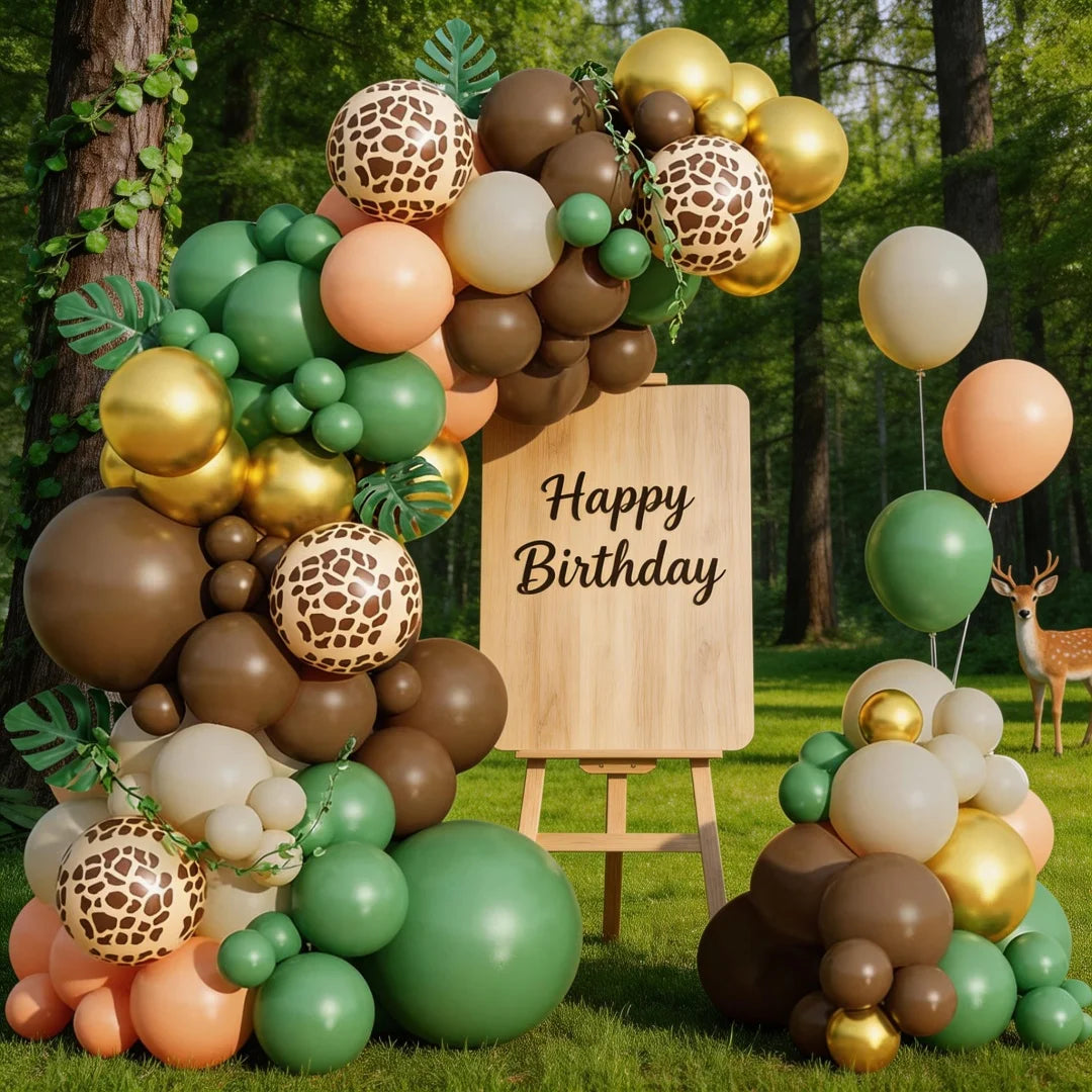 A balloon garland featuring earthy tones and giraffe print patterns, including gold, brown, and green balloons.