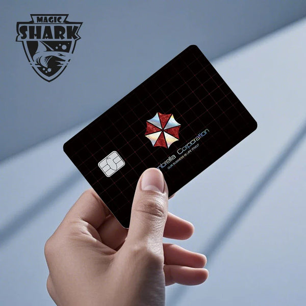 A hand holds a black card with a holographic design and the Magic Shark logo visible on the background.