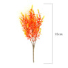 A bouquet of bright orange and yellow artificial daisy flowers for autumn home decor.