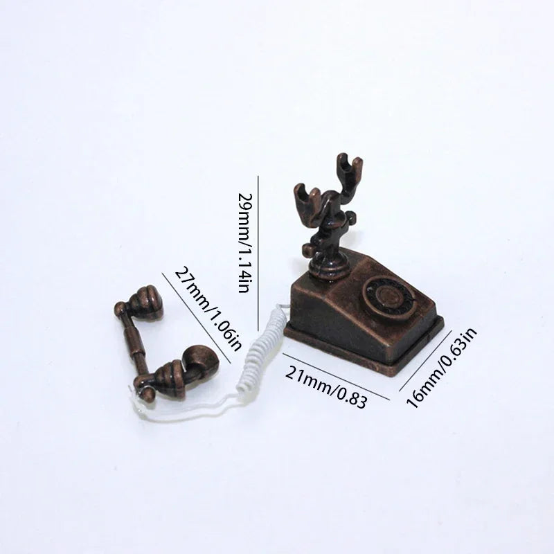 A vintage rotary desk phone miniature decor with a dark bronze finish and a white cord.