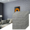 Gray 3D foam brick wallpaper panels stacked to show texture and detail