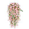 A vertical arrangement of pink and white artificial morning glory flowers used for outdoor decor.