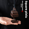 A hand holds a square pixiu zinc alloy incense burner emitting smoke.
