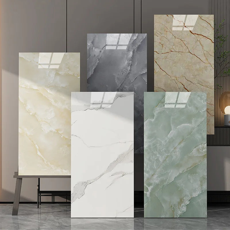 A display of various marble wall decals in beige, gray, and green tones.