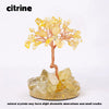 A natural crystal tree featuring yellow citrine crystals growing from a base.