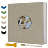 A DIY magnetic scrapbook album with a beige cover and a gold tool.