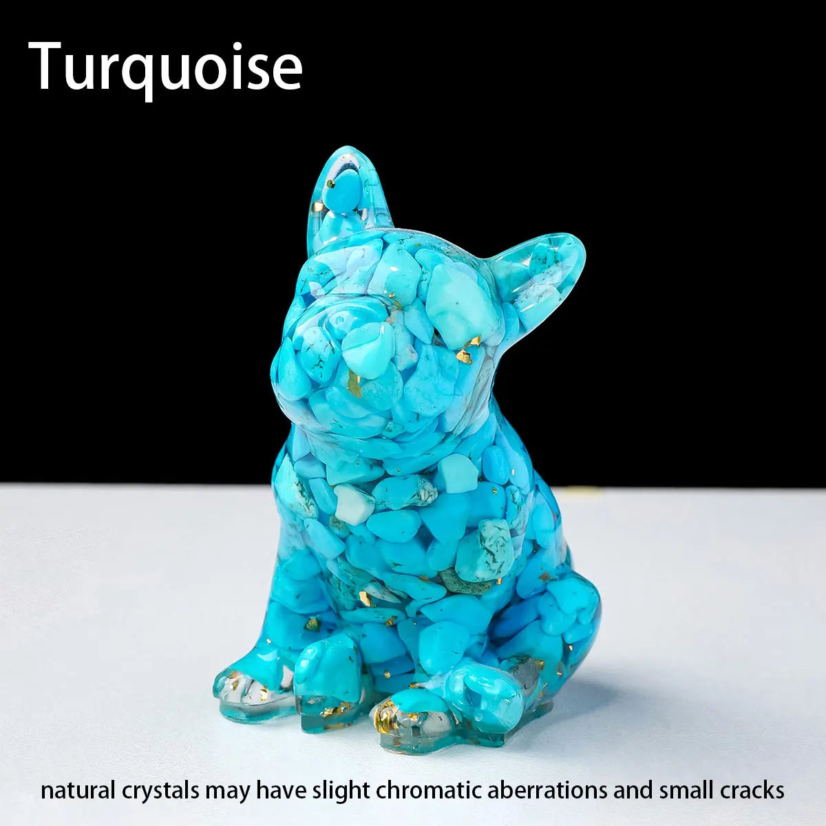 A turquoise crystal dog statue with small cracks sits on a white surface.