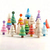 A collection of colorful wooden DIY Christmas tree ornaments in various shapes and sizes.